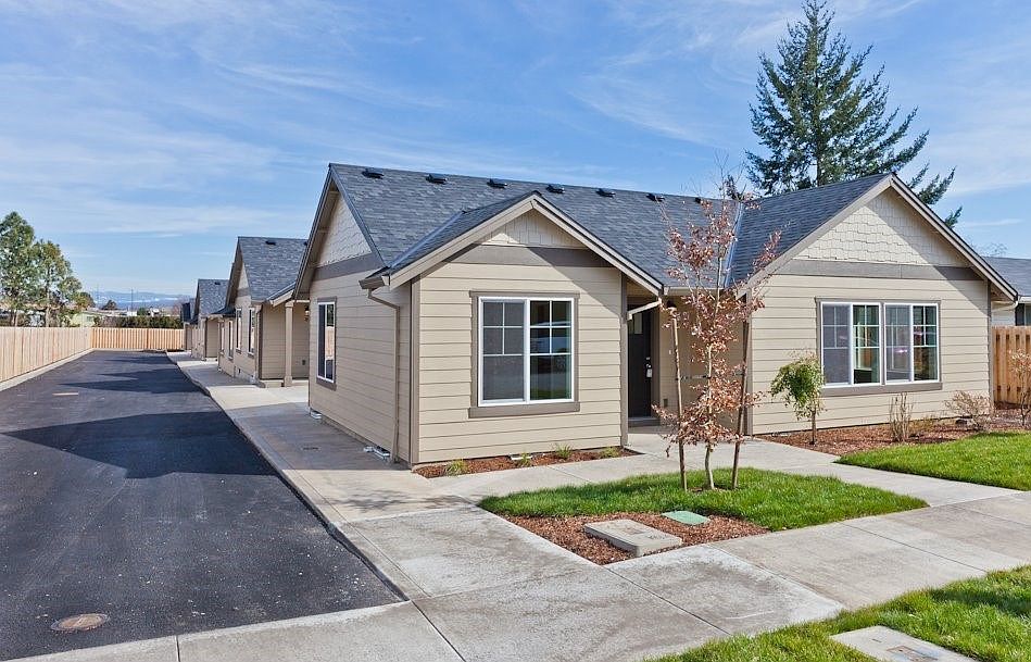 Garage is attached at the side with entry into the living room.