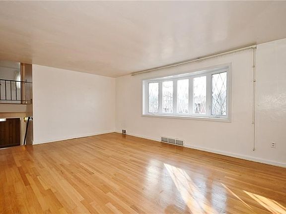 Beautiful hardwood floors in this very spacious living room, large bay window allows you to enjoy the beautiful sunlight.
