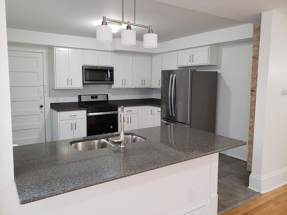 Gorgeous kitchen. New appliances, cupboards, flooring, and countertops.