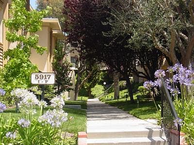 Walkway to the condo, which is on the left. This is a very quiet area with lots of greenery.