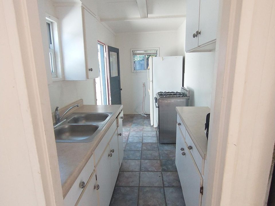 Kitchen. Includes double sinks, fridge, stove, lots of counterspace