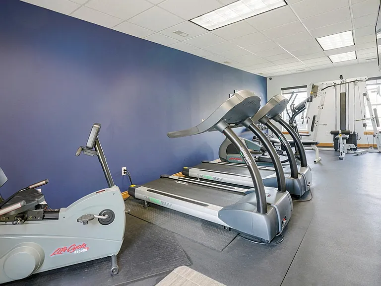 Our 24-hour fitness center features cardio equipment and weight lifting machines