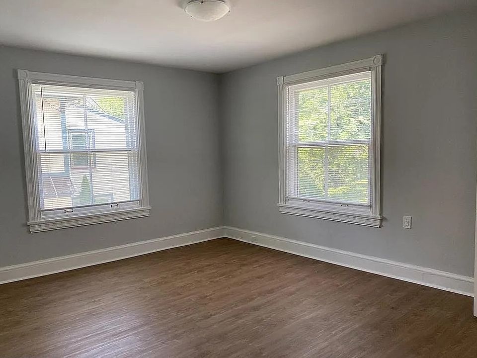 Bright and spacious bedroom with large windows, abundant natural light, and updated flooring. Freshly painted with neutral finishes, creating a clean and inviting living space.