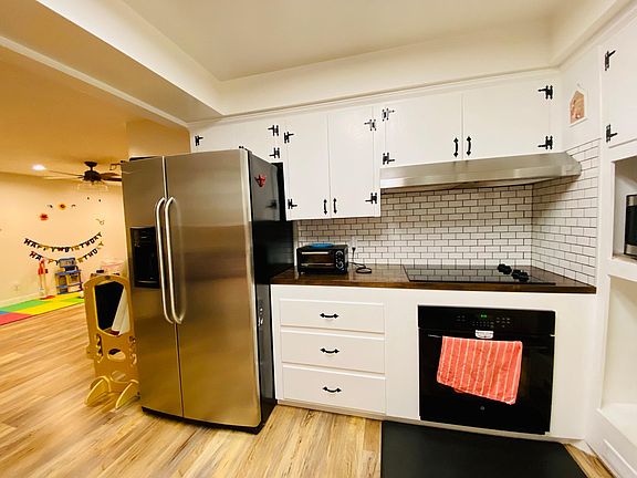 Cooktop, oven, stainless steel fridge