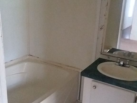 Master bath with extra large tub and toilet not captured in