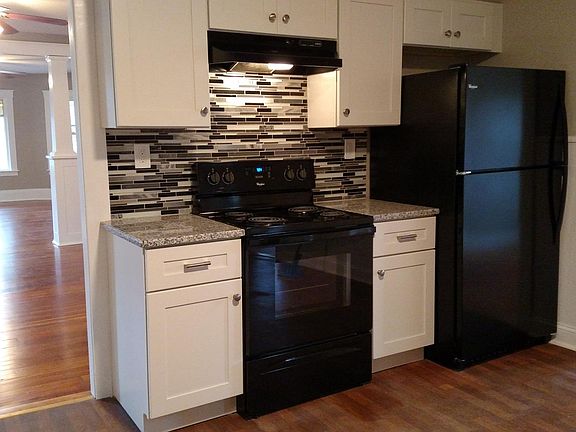 New Shaker cabinets, granite and tile back splash