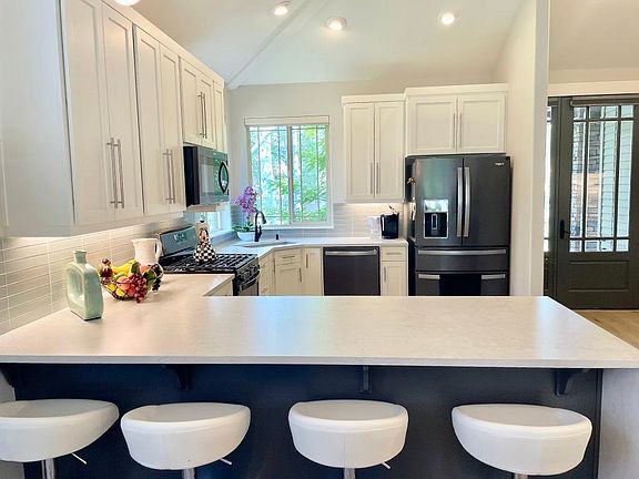 4 barstools overlooking the kitchen