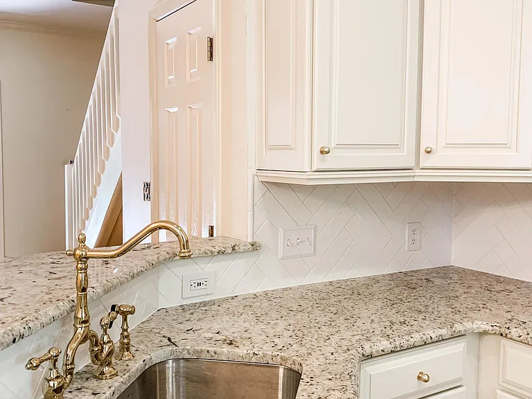 Brass faucet ample counterspace.