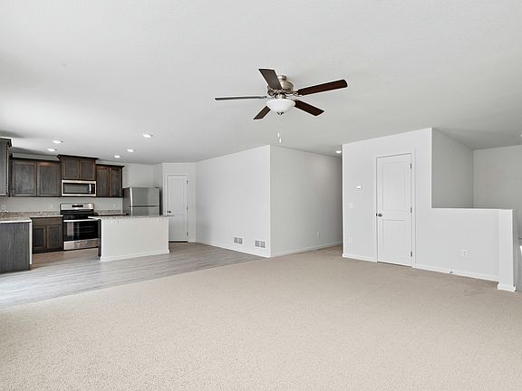 The open entertainment space includes the dining room, the kitchen, and the family room