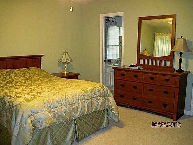 Master on Main suite features bath with separate tub and shower and walk in cl
