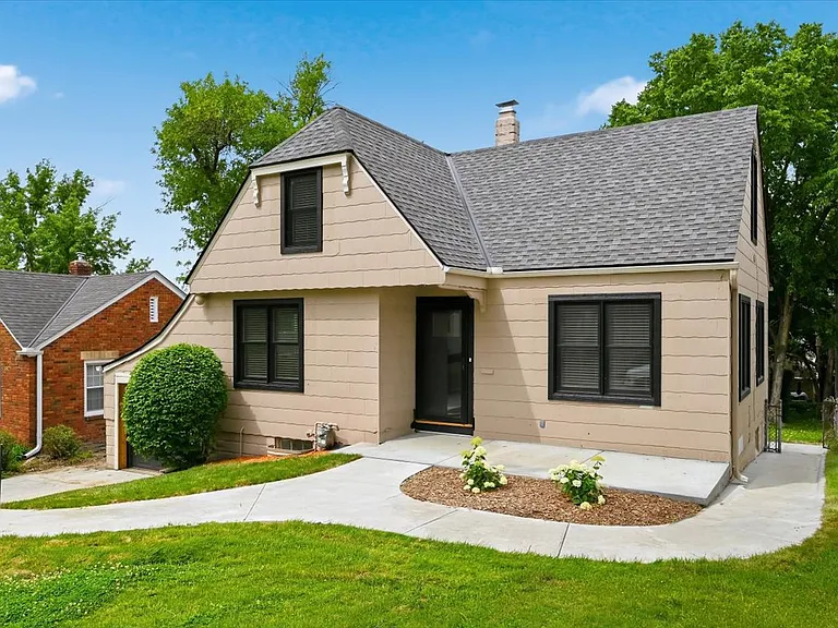 New windows, new front and storm door. Fresh sod, mulch, and hydrangea bushes.