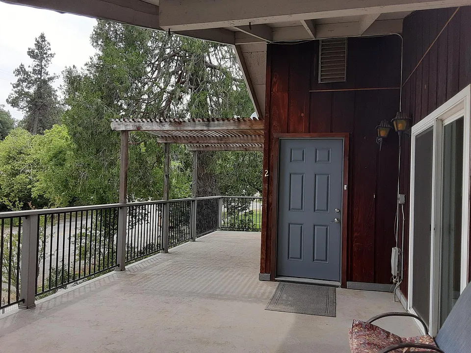 Front door of #2, sliding doors to right are entrance to @1.