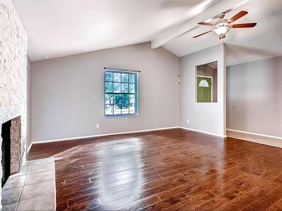 Living room facing entryway.
