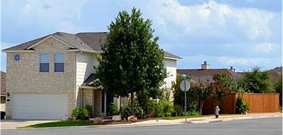 Large, beautifully landscaped corner lot with a new custom-tailo