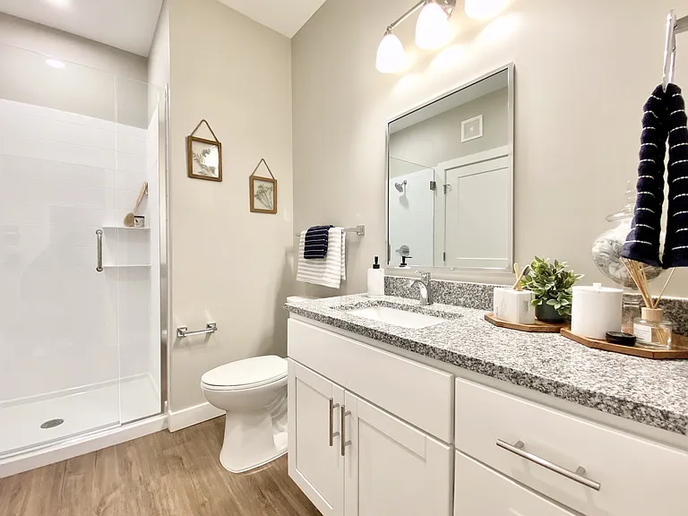 Sleek finishes, a walk-in shower, and plenty of counter space to start or end your day. Sleek finishes, a walk-in shower, and plenty of counter space to start or end your day.