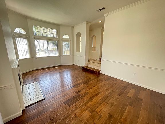 End unit with lots of natural light flown in.