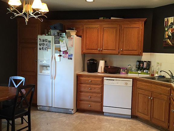 Kitchen with all appliances (refrigerator, dishwasher, stove/oven, brand-new microwave).