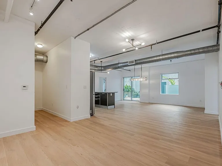 Large, open floor plan with new flooring throughout