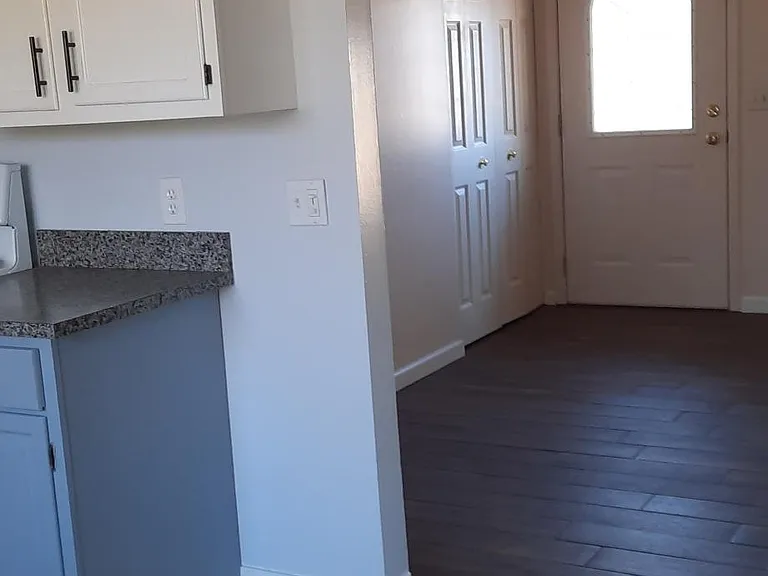 Kitchen, living room, front entrance.