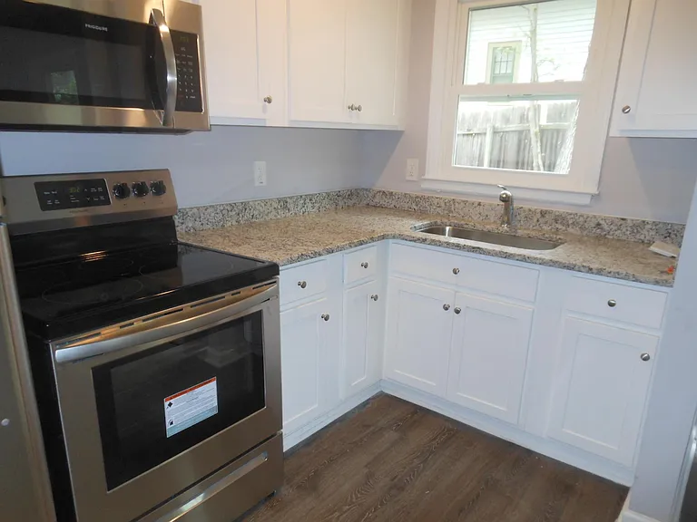 Granite countertops, new range, new refrigerator, new cabinets, new sinks, and more.