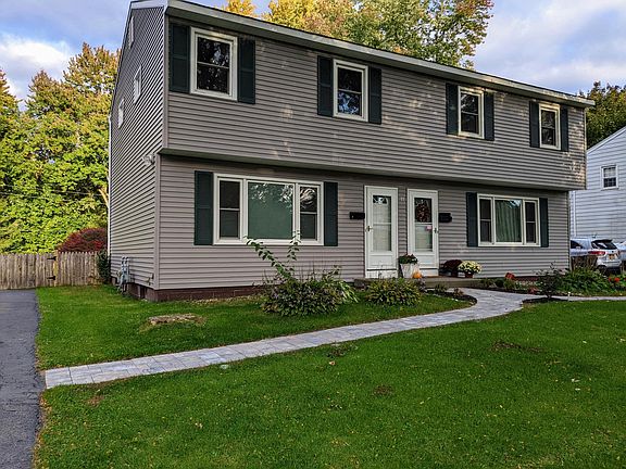 Apartment "A" is on the left. Space for two cars on driveway.