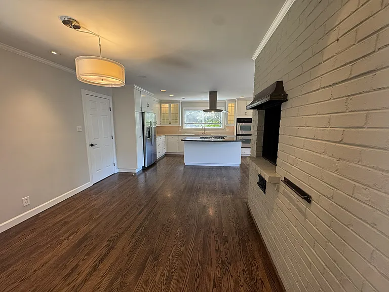 Another view of the kitchen from the breakfast nook. Garage door on the left, there is another room in the garage that could be a fantastic private office.