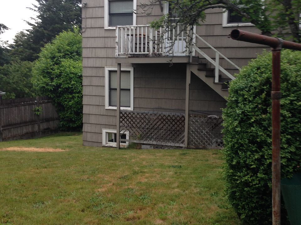 Back yard of duplex with Entrance to the unit