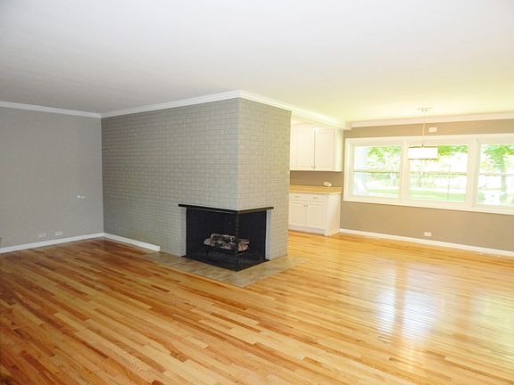 Two sided gas fireplace and gleaming hardwoods make this home modern and ready for you to bring your ideas!!