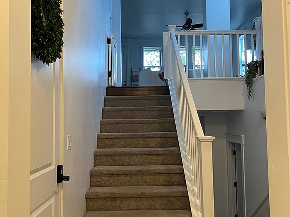Foyer stairs to great room (living, dining, kitchen)