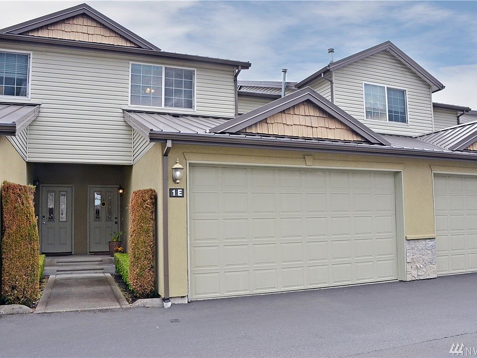 Front of house showing two car garage.