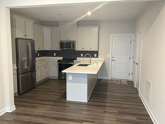 Kitchen with walk in storage to the right .