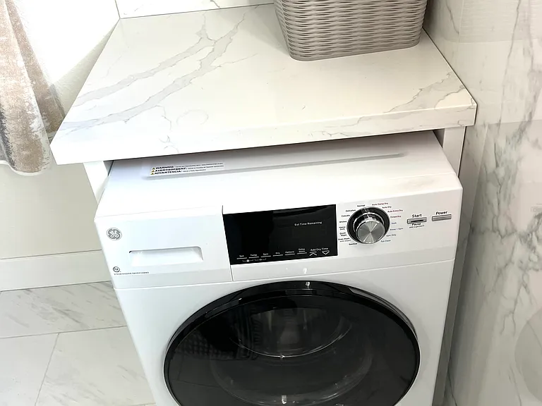 Compact washer & dryer. Put your clothes in and 3 hours later pull out your clean and dry clothes. Priceless!