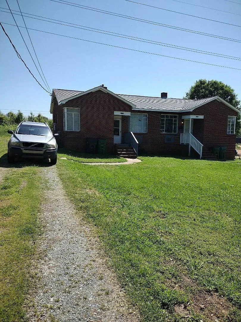 This 2 bed 1 bath duplex home is all brick located near Remount Rd and West Blvd. — Photo 2