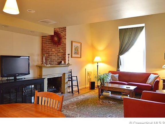 Living room with wood burni...