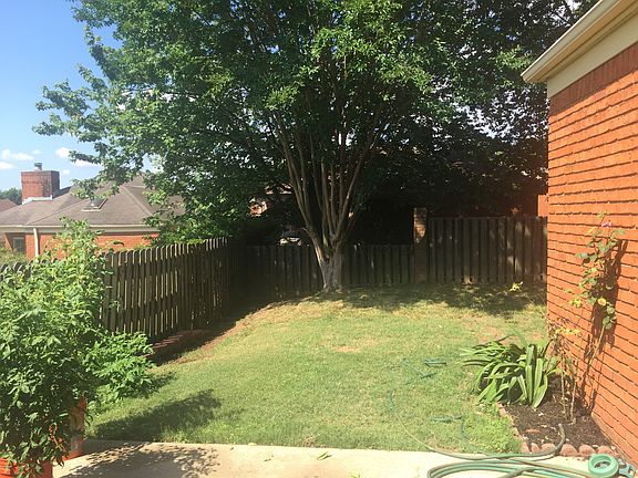 Large, flat fenced backyard