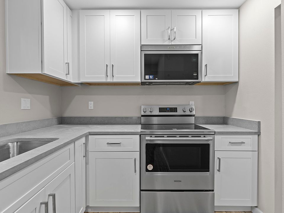 Kitchen with new stainless steel appliances and Quartz countertops