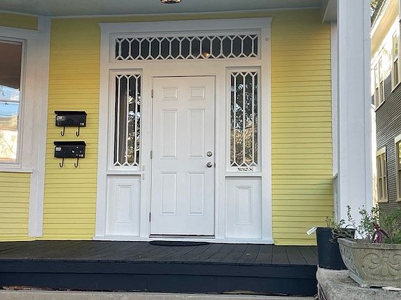 Main secured front door from first floor porch to entry vestibule. Each apartment has separate secured entry from vestibule.
