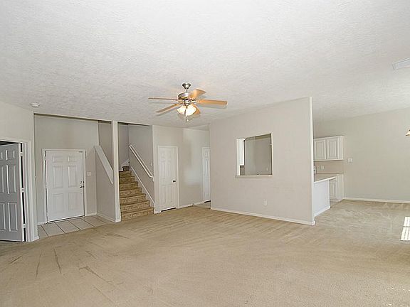 Look at this open floor plan! Large livingroom with easy access to kitchen and dining area.