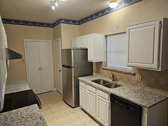 Spacious kitchen with granite tops