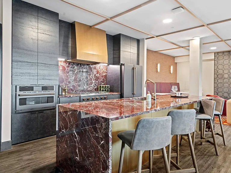 Resident Kitchen in Lounge Overlooking Amenity Deck at The Hallon Luxury Apartments in Hopkins MN