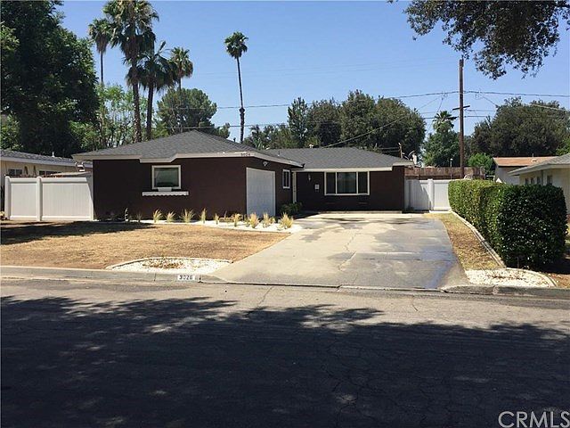 Front of Home. drought resistant landscape & rocks, new windows, paint/stucco.