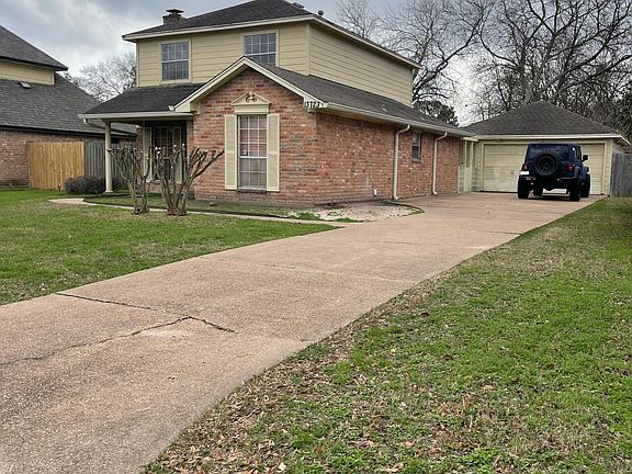 Ample driveway to park plus detached 2 car garage and breezeway for comfort and security