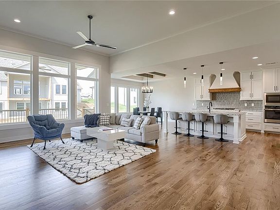 Open kitchen and living space with wood floors