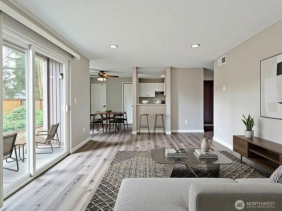 Living room to view of kitchen staged virtually
