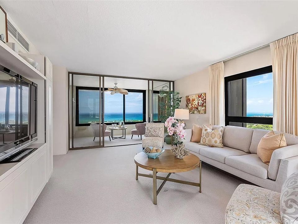 Living room has windows and with city lights views!