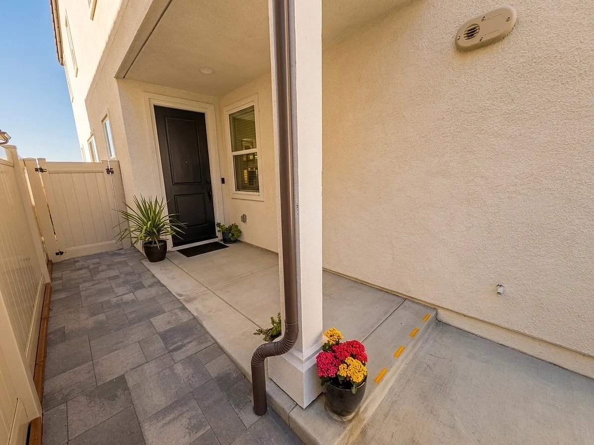 Front door with side storage area gate access. - 1358 Blue Port Way
