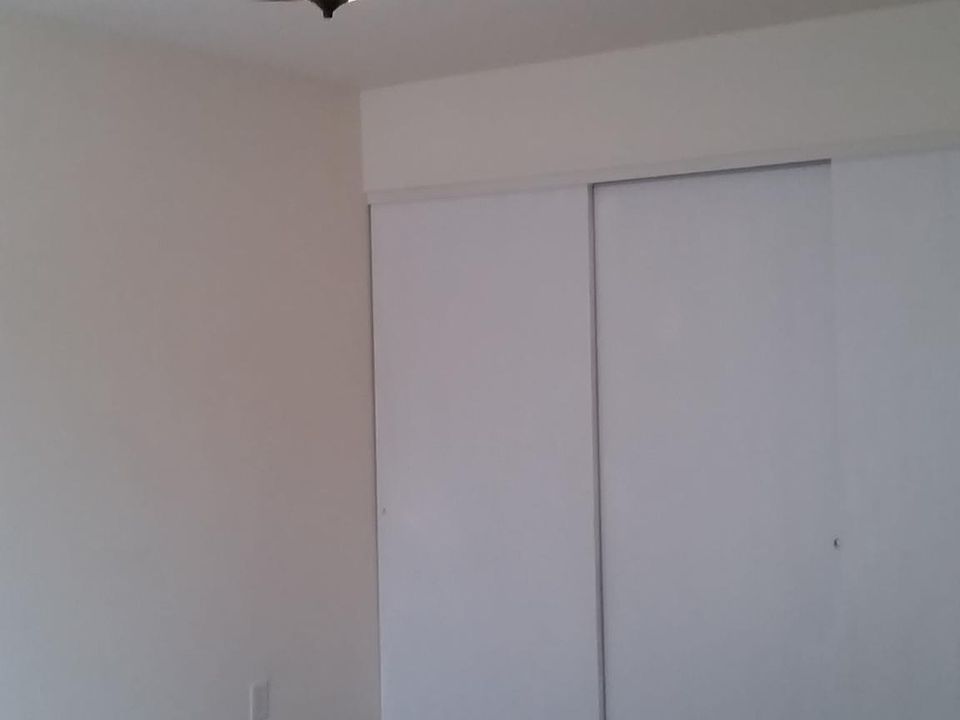 Masterbedroom has sliding door with deck off back of condo