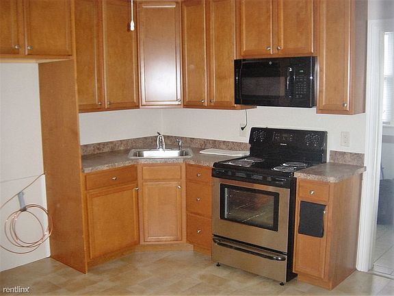 New Kitchen: floor. Cabinets, range, microwave, countertops