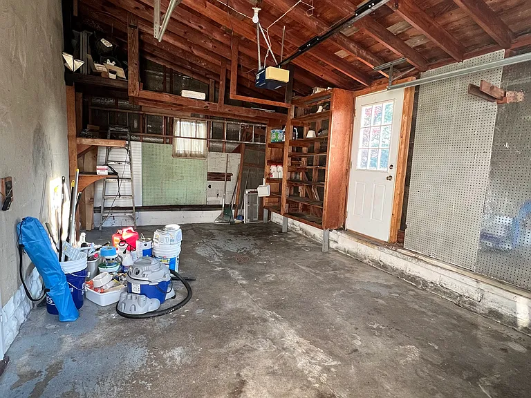 Garage. The garage opens into a stairway that leads to the basement or the kitchen.