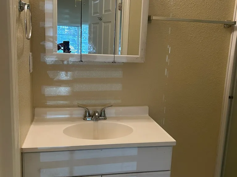 Attached bathroom in downstairs bedroom, freshly painted interiors
